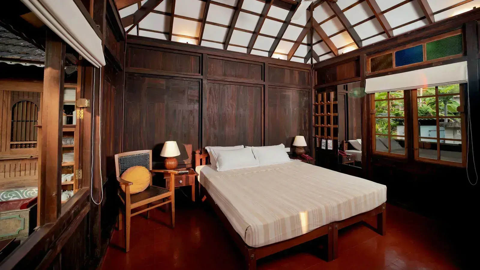 A view of a king size bed in the Heritage Cottage at Samiira on Ashtamudi Lake.