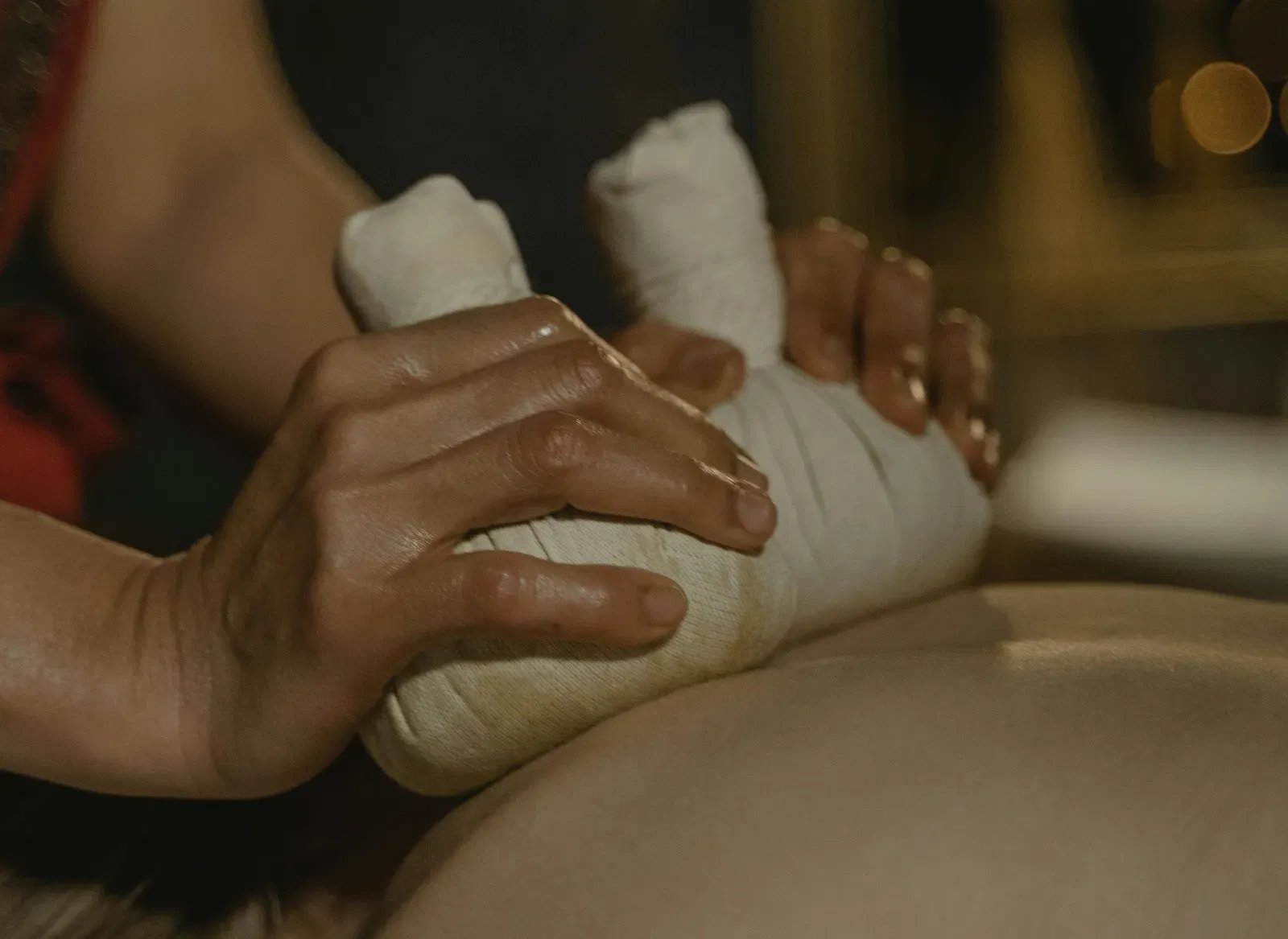 A woman getting a back massage through Ayurvedic methods.