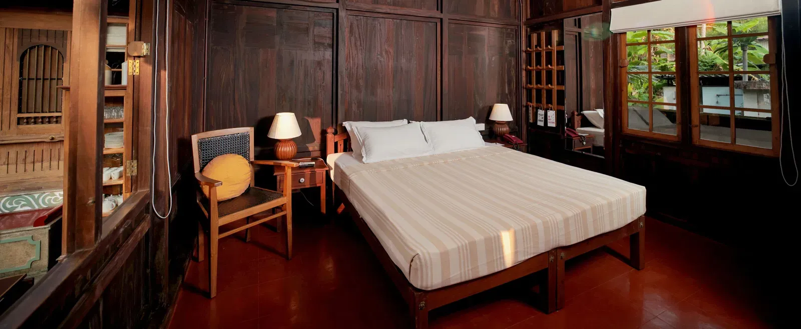 A view of a king size bed in the Heritage Cottage at Samiira on Ashtamudi Lake.