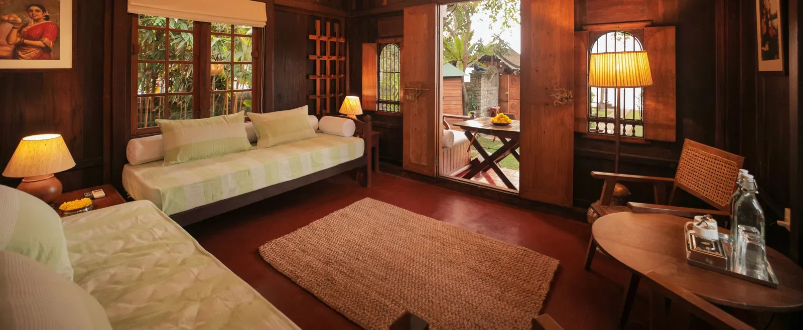 A view of the living room with comfortable seating at Heritage Cottage at Samiira on Ashtamudi Lake.