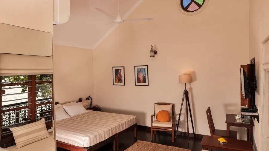 A view of a king size bed in Lake Front Verandah Room at Samiira on Ashtamudi Lake.
