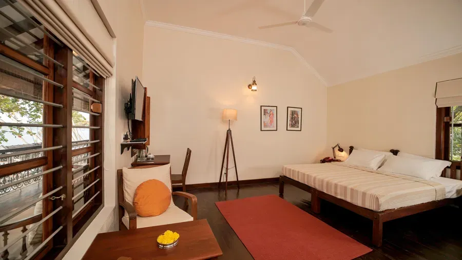 A view of a king size bed in Lake Front Verandah Room at Samiira on Ashtamudi Lake.