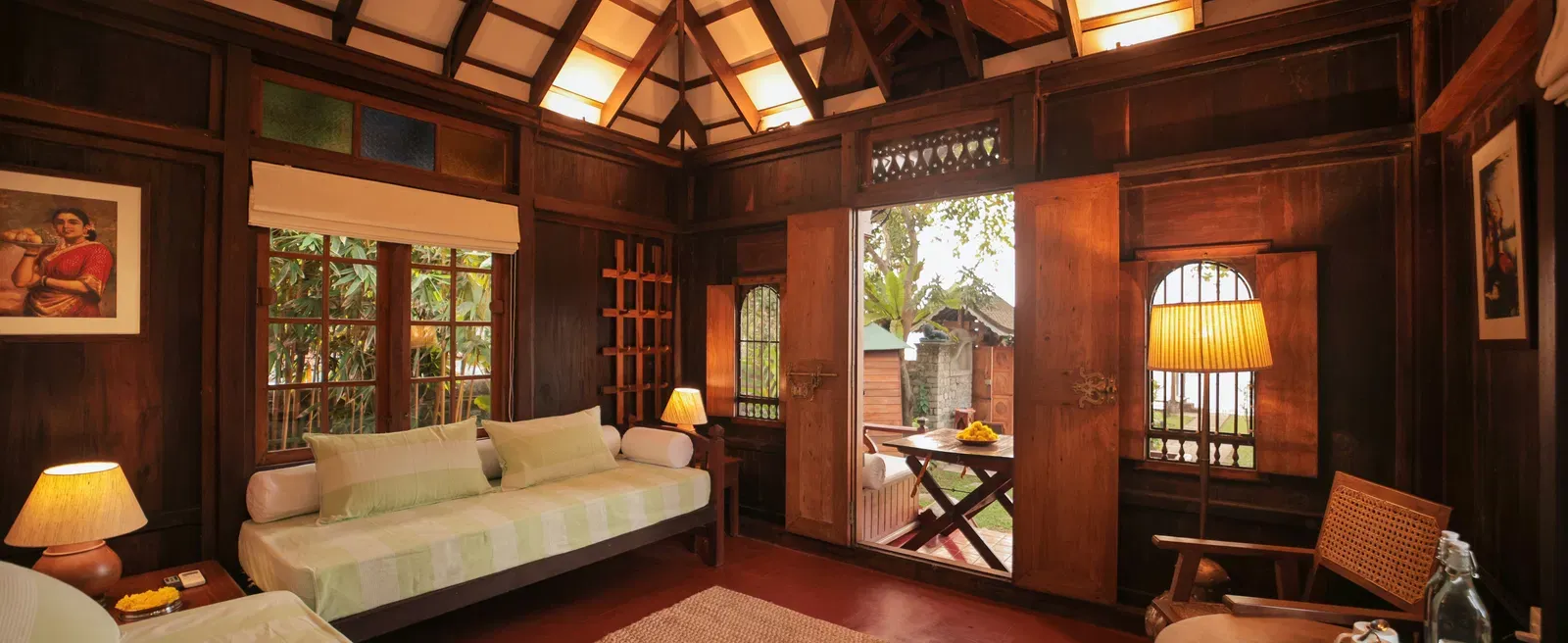 A view of the living room with comfortable seating at Heritage Cottage at Samiira on Ashtamudi Lake.