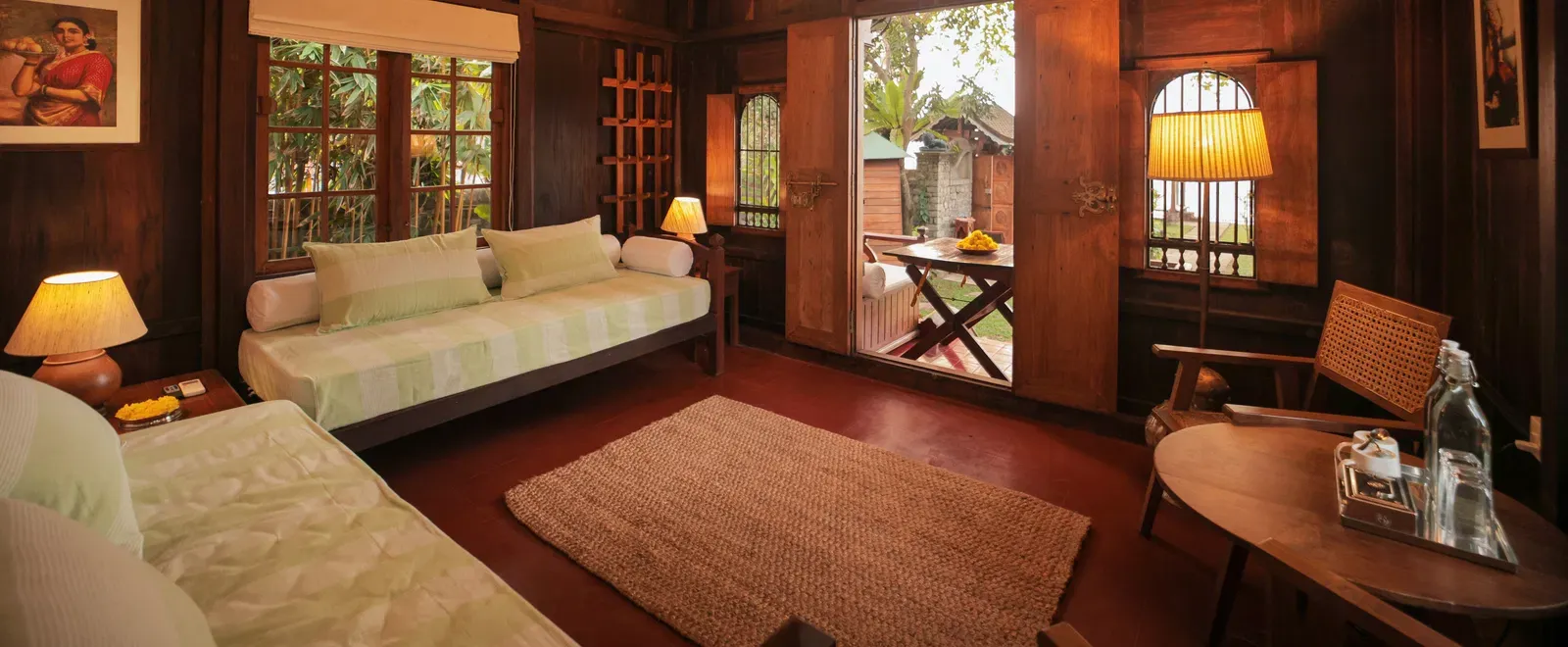 A view of the living room with comfortable seating at Heritage Cottage at Samiira on Ashtamudi Lake.