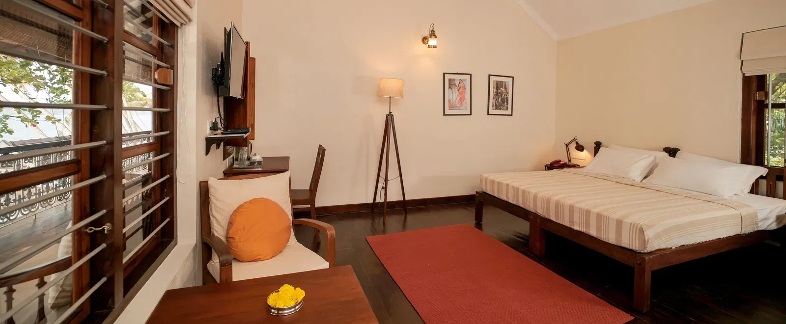 A view of a king size bed in Lake Front Verandah Room at Samiira on Ashtamudi Lake.