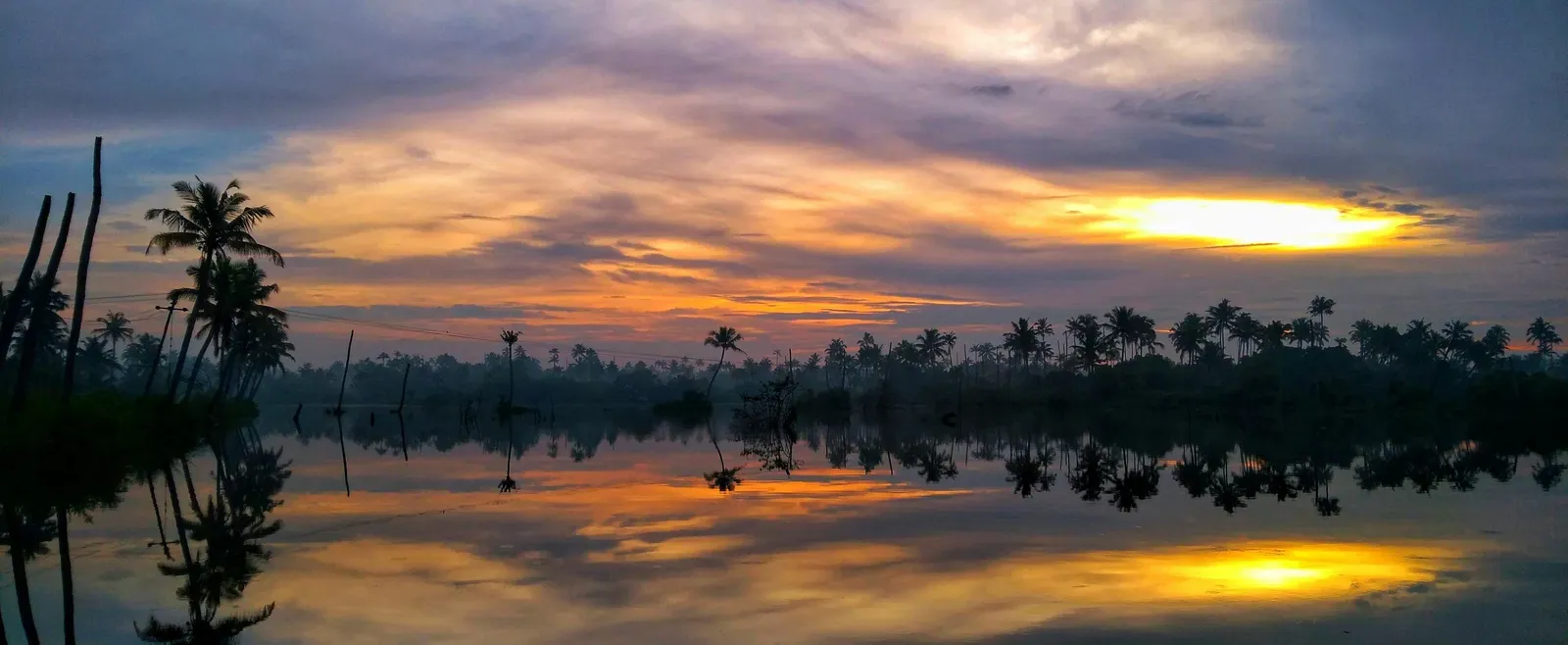 Scenic view of a lake at sunset.