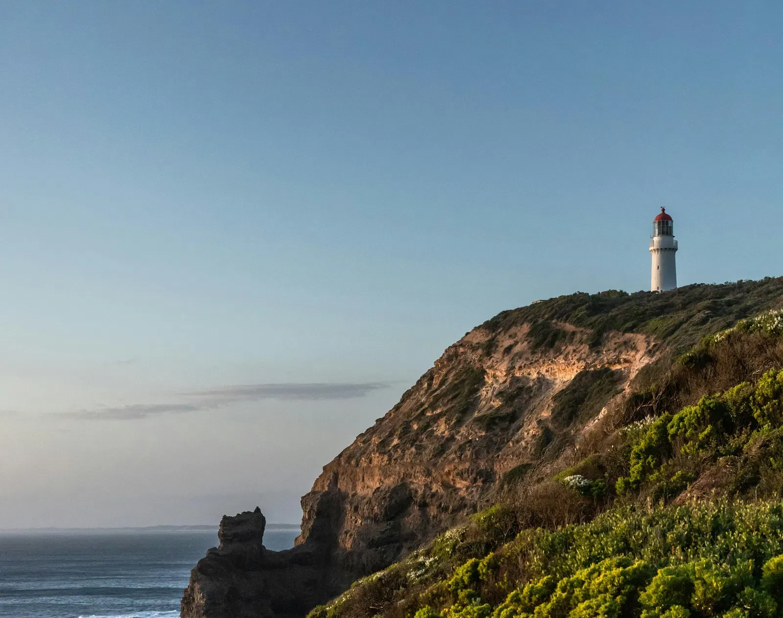 A man standing on the edge of a cliff.