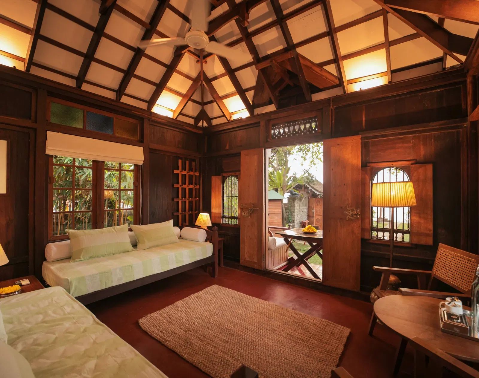 A view of the living room with comfortable seating at Heritage Cottage at Samiira on Ashtamudi Lake.